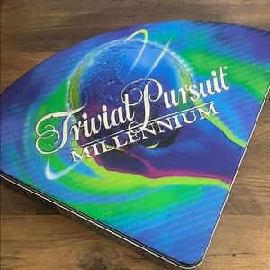 Hasbro Trivial Pursuit Millennium Board Game with Storage Tin